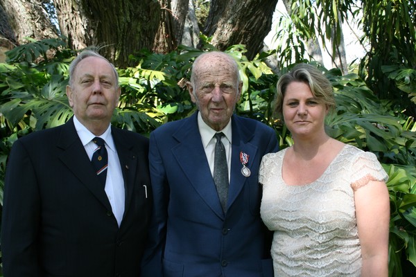 Trevor Hosking QSM (centre) with family members Noel Hosking and Janet Blaauw at the ceremony in Auckland.